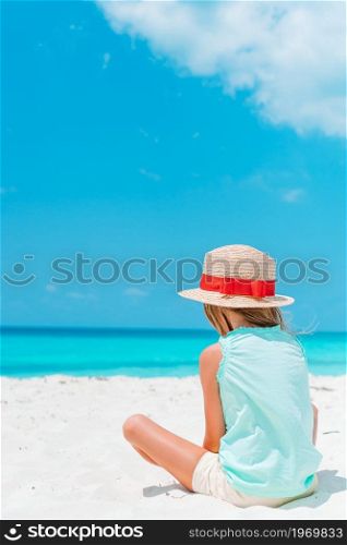 Adorable little girl at tropical beach on vacation. Adorable little girl on tropical beach