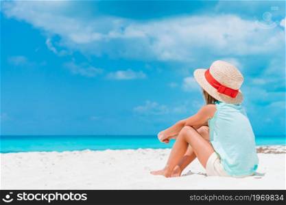 Adorable little girl at tropical beach on vacation. Adorable little girl on tropical beach