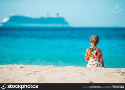 Adorable little girl background big liner in Mediterranean sea. Little girl in european town outdoors on Mykonos island