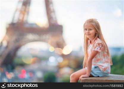 Adorable little girl in Paris background the Eiffel tower in France. Adorable toddler girl in Paris background the Eiffel tower during summer vacation