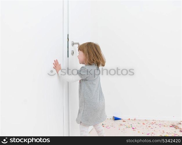 adorable Little girl standing on confetti after party