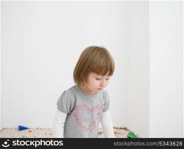 adorable Little girl standing on confetti after party