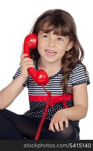 Adorable little girl wiht red phone isolated on white background
