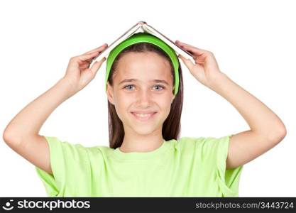 Adorable little girl with a book on the head isolated on white background