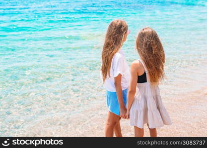 Adorable little girls on the beach. Adorable little girls having fun on the beach