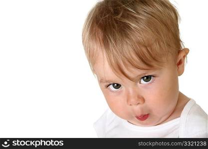 Adorable one year old baby boy making faces.