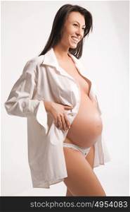 Adorable, pregnant young woman - isolated