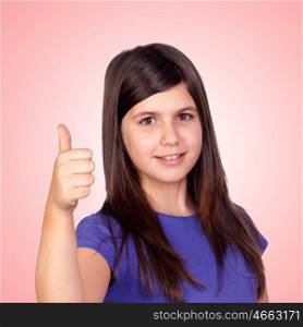 Adorable preteen girl accepting with the tumbs isolated on orange background