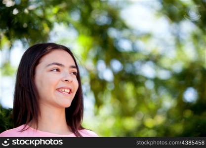 Adorable preteen girl with plants of background
