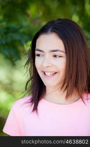 Adorable preteen girl with plants of background