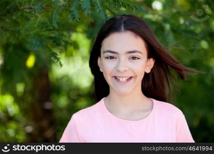 Adorable preteen girl with plants of background