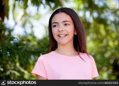 Adorable preteen girl with plants of background