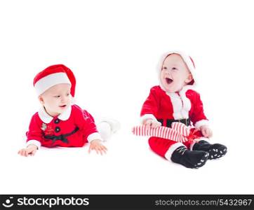 Adorable Santa babies - boy and girl isolated on white