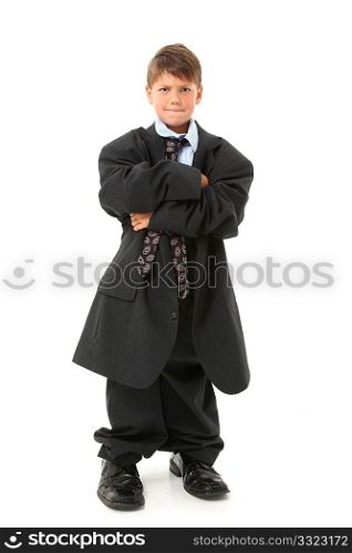 Adorable seven year old american boy in over sized suit.