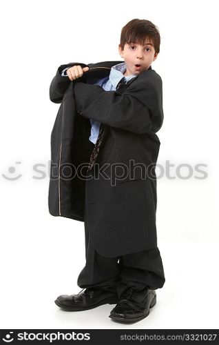 Adorable seven year old french american boy in over sized large suit over white.