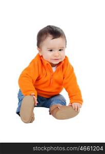 Adorable six month baby with orange jersey isolated on white background