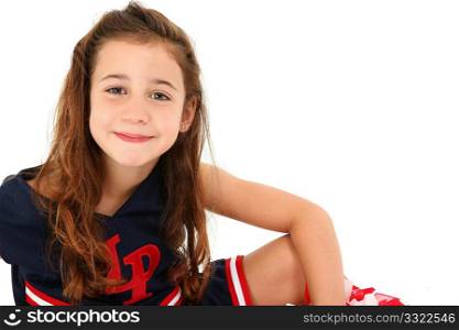Adorable six year old french american girl cheerleader over white.