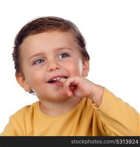 Adorable small child two years old sucking his hand