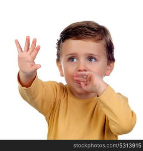 Adorable small child two years old sucking his hand isolated on a white background