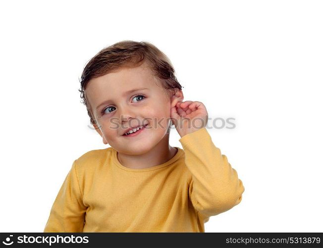 Adorable small child two years old touching his ear isolated on a white background