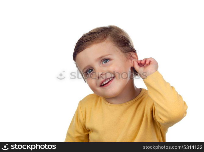 Adorable small child two years old touching his ear isolated on a white background