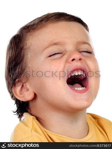Adorable small child two years old with yellow t-shirt opening his mouth isolated on a white background