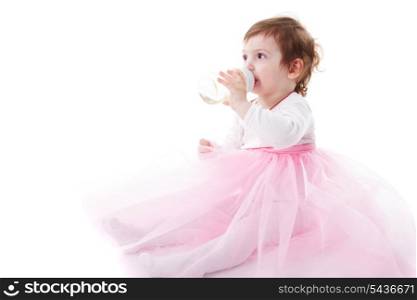 Adorable toddler girl is drinking isolated on white