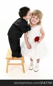 Adorable Two Year Old Boy Puckered Up To Give His Girl A Kiss. Shot in studio over white
