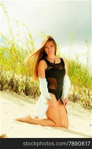 Adorable woman female model in full length posing outdoor on grassy dunes