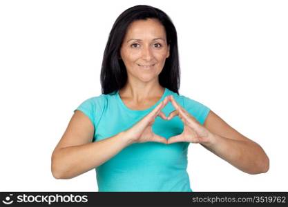 Adorable woman making a heart with the hand isolated on a over white background