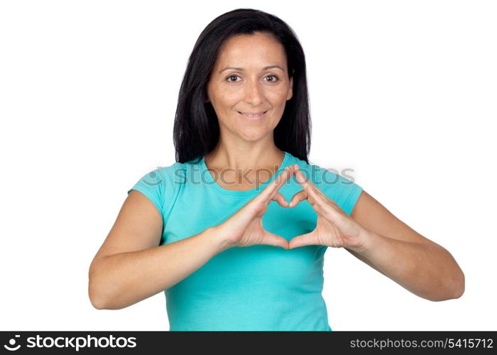 Adorable woman making a heart with the hand isolated on a over white background