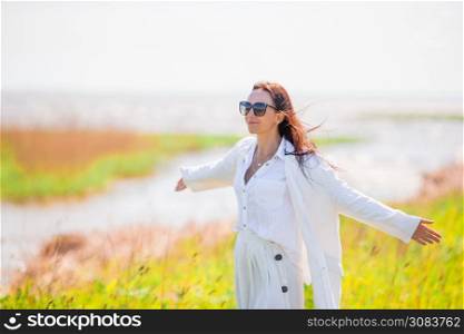 Adorable woman on the wild beach. Adorable woman at beach during summer vacation
