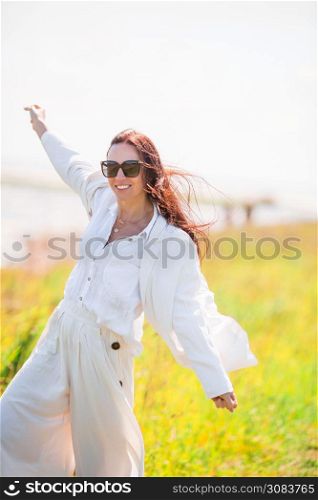 Adorable woman on the wild beach. Adorable woman at beach during summer vacation