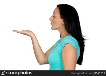 Adorable woman withaextendedapalm blowing something isolated on a over white background
