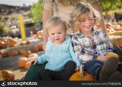 Adorable Young Family Enjoys a Day at the Pumpkin Patch.