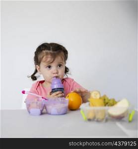 adorable young girl with fruit bowl