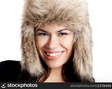Adorable young woman with a beautiful smile and wearing a hat