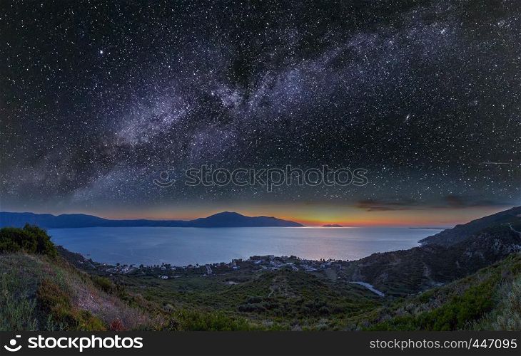 Adriatic sea night coast top panorama view (coastline between Orikum and Vlore, Albania) and starry Milky Way in sky