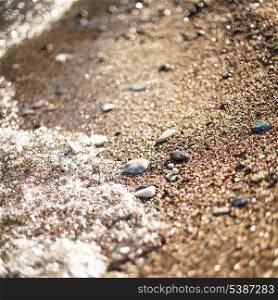 Adriatic sea pebble shore, as an abstract background for design. Vocation concept. Shallow deep of field