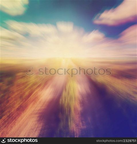 adstract blurred vintage photo of field and blue sky
