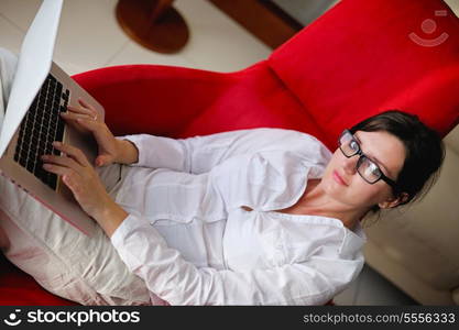 adult, beautiful, beauty, brunette, casual, caucasian, computer, couch, face, female, fun, girl, happy, home, house, indoor, indoors, interior, internet, keyboard, laptop, leisure, life, lifestyle, living, living room, modern, notebook, one, online, people, person, portrait, pretty, relax, room, smile, smiling, sofa, student, technology, typing, using, web, white, window, wireless, woman, work, young