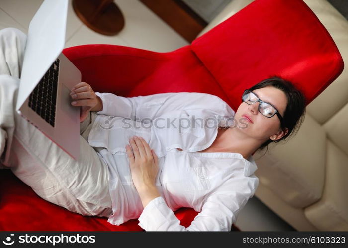 adult, beautiful, beauty, brunette, casual, caucasian, computer, couch, face, female, fun, girl, happy, home, house, indoor, indoors, interior, internet, keyboard, laptop, leisure, life, lifestyle, living, living room, modern, notebook, one, online, people, person, portrait, pretty, relax, room, smile, smiling, sofa, student, technology, typing, using, web, white, window, wireless, woman, work, young