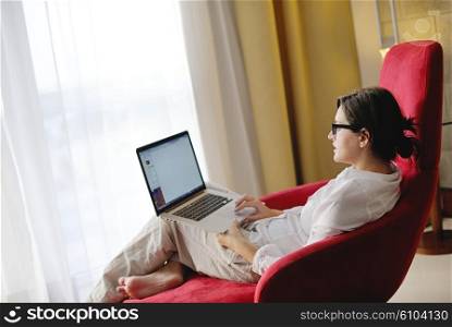 adult, beautiful, beauty, brunette, casual, caucasian, computer, couch, face, female, fun, girl, happy, home, house, indoor, indoors, interior, internet, keyboard, laptop, leisure, life, lifestyle, living, living room, modern, notebook, one, online, people, person, portrait, pretty, relax, room, smile, smiling, sofa, student, technology, typing, using, web, white, window, wireless, woman, work, young