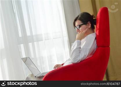 adult, beautiful, beauty, brunette, casual, caucasian, computer, couch, face, female, fun, girl, happy, home, house, indoor, indoors, interior, internet, keyboard, laptop, leisure, life, lifestyle, living, living room, modern, notebook, one, online, people, person, portrait, pretty, relax, room, smile, smiling, sofa, student, technology, typing, using, web, white, window, wireless, woman, work, young