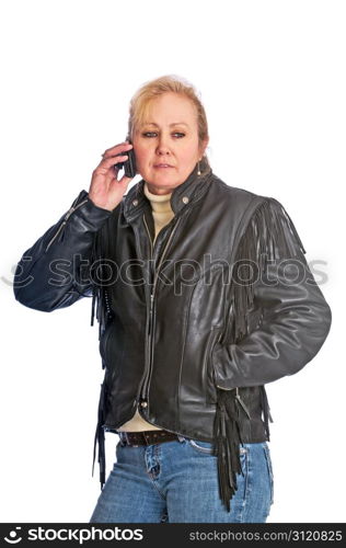 Adult blonde woman wearing a leather jacket talking on her cell phone