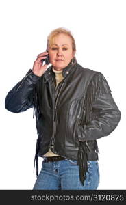 Adult blonde woman wearing a leather jacket talking on her cell phone