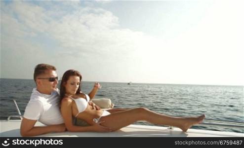 Adult Couple Enjoying the Cruise on Luxury Yacht
