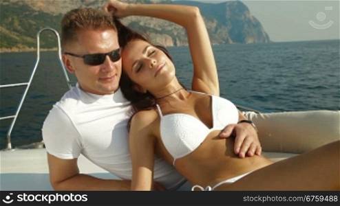 Adult Couple Enjoying the Cruise on Luxury Yacht