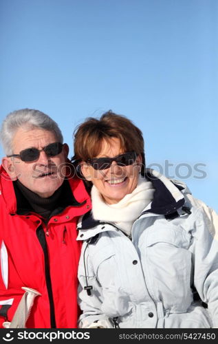 Adult couple skiing