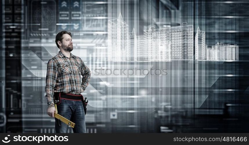 Adult engineer man. Builder man in checked shirt with tool belt on waist